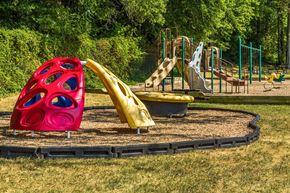Alexandria apartment for rent - a playground with a red slide and a yellow slide