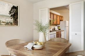 Silver Spring apartment for rent - a kitchen and dining room with a wooden table and chairs