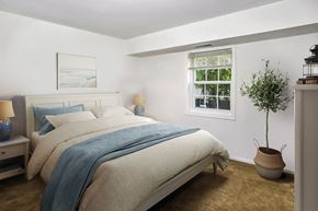 Cockeysville apartment for rent - a bedroom with a bed and a window