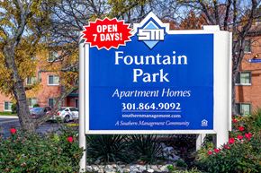 Hyattsville apartment for rent - a sign for fountain park apartment homes in front of a building