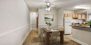 Bladensburg apartment for rent - a dining room and kitchen with a table and chairs