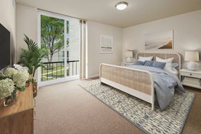 Greenbelt apartment for rent - a bedroom with a bed and a large window