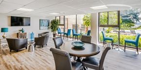 Alexandria apartment for rent - a conference room with a table and chairs and a television