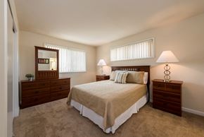 Laurel apartment for rent - a bedroom with a bed and two dressers