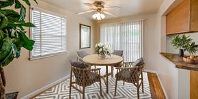 Woodbridge apartment for rent - a dining room with a table and chairs and a ceiling fan