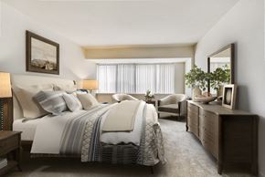 Columbia apartment for rent - a bedroom with a bed and a chair and a dresser