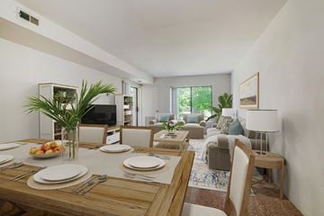 Rockville apartment for rent - a living room and dining room with a table and chairs