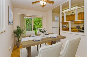 Silver Spring apartment for rent - a dining room with a table and chairs and a window