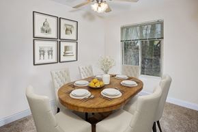 Crofton apartment for rent - a dining room with a table and chairs and a window