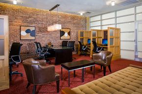 Ellicott City apartment for rent - a conference room with leather chairs and a brick wall
