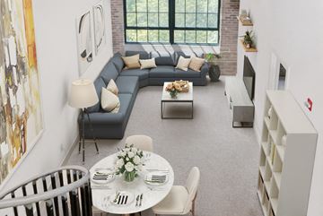 Ellicott City apartment for rent - a living room with a blue couch and a table and chairs