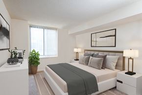 Bethesda apartment for rent - the living room of a bedroom with a bed and a window