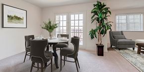 Annandale apartment for rent - a dining room with a table and chairs and a plant