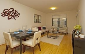 Hanover apartment for rent - A dining room with a table set for two and a couch.