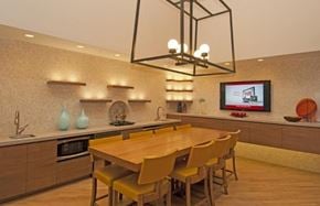 Hanover apartment for rent - A modern kitchen with a wooden table and chairs.