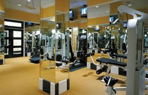 Baltimore apartment for rent - a gym with a lot of exercise equipment in it