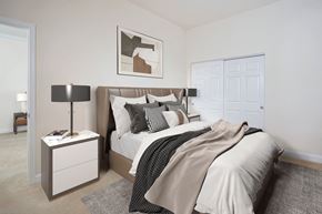 Baltimore apartment for rent - a bedroom with white walls and a bed with white sheets and pillows