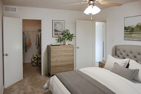 Laurel apartment for rent - a bedroom with a bed and a dresser and a closet
