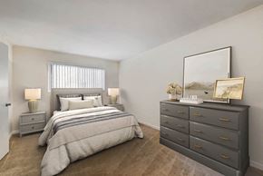 Gaithersburg apartment for rent - a bedroom with a bed and a dresser