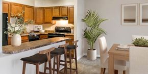 Gaithersburg apartment for rent - a kitchen and dining room with a table and chairs