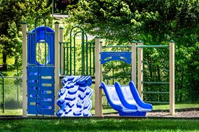 Gaithersburg apartment for rent - a playground with blue chairs and a blue gate