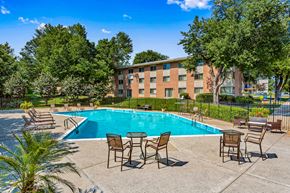 Gaithersburg apartment for rent - our apartments offer a swimming pool with chairs and tables