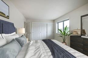 Hyattsville apartment for rent - a bedroom with a large bed and a window