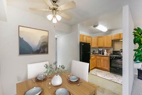 Hyattsville apartment for rent - a dining room table with a kitchen in the background