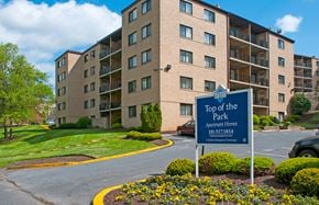 Hyattsville apartment for rent - top of the park sign in front of an apartment building