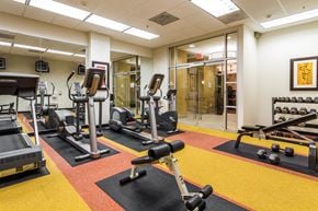 Bethesda apartment for rent - a fitness center with weights and other exercise equipment in a building