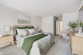 Silver Spring apartment for rent - a bedroom with a bed and a dresser and a window
