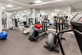 Silver Spring apartment for rent - a gym with cardio equipment and weights on the floor