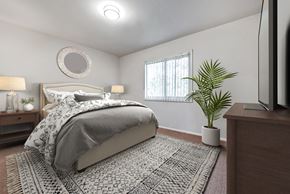 Vienna apartment for rent - a bedroom with a bed and a potted plant