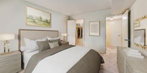 Woodbridge apartment for rent - a bedroom with a large bed and a closet