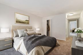 Lanham apartment for rent - a bedroom with a large bed and a closet