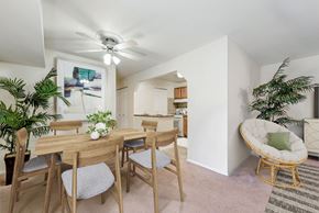 Alexandria apartment for rent - a dining room with a table and chairs and a ceiling fan
