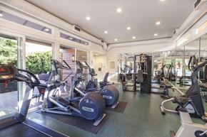 San Jose apartment for rent - A gym with treadmills, exercise bikes, and other equipment.