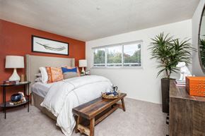 Gilroy apartment for rent - a bedroom with a bed and a window
