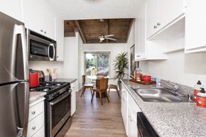 Cupertino apartment for rent - a kitchen with stainless steel appliances and granite counter tops