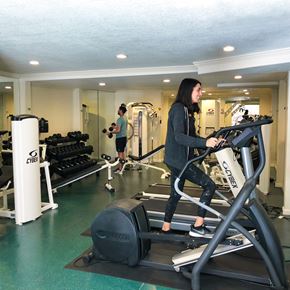 Mountain View apartment for rent - A person is using a treadmill in a gym.