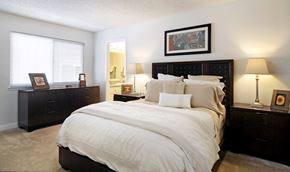 Mountain View apartment for rent - a bedroom with a bed and two dressers and a mirror