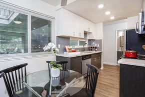 Santa Clara apartment for rent - a kitchen and dining room with a glass table and chairs