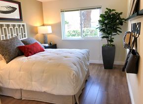 Santa Clara apartment for rent - a bedroom with a bed and a potted plant
