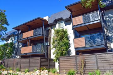 Campbell apartment for rent - A modern house with a balcony and a fence.