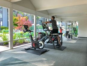 Mountain View apartment for rent - a man on a exercise bike in a gym