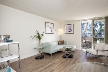 Mountain View apartment for rent - a living room with a couch and a table and a window