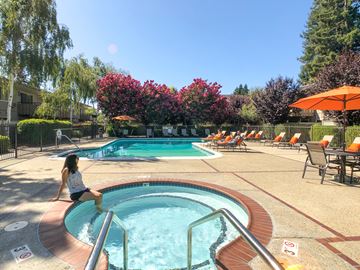 Mountain View apartment for rent - A woman is sitting on the edge of a small pool.