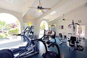 Santa Clara apartment for rent - a gym with cardio machines and a ceiling fan