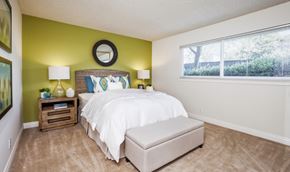 Cupertino apartment for rent - a bedroom with a large bed and a window