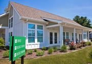 Cecilton apartment for rent - a small white house with a green sign in front of it